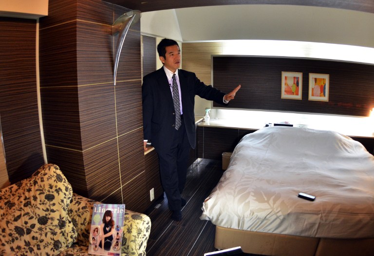 a love hotel consultant Masakatsu Tsunoda speaking to an AFP reporter in a room of the Two-Way hotel in Tokyo. 