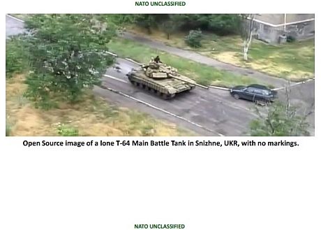 a lone T-64 driving through Snizhne, Ukraine.