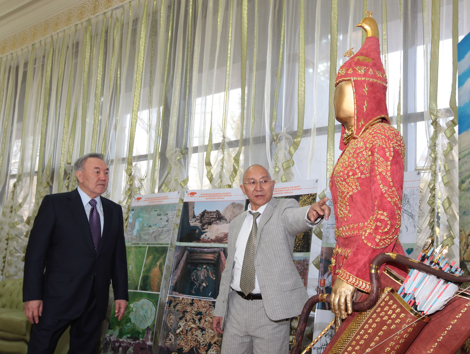 Kyrm Altynbekov shows President Nursultan Nazarbayev his family's reconstruction of the garb of a Saka warrior. Photo courtesy of Krym Altynbekov
