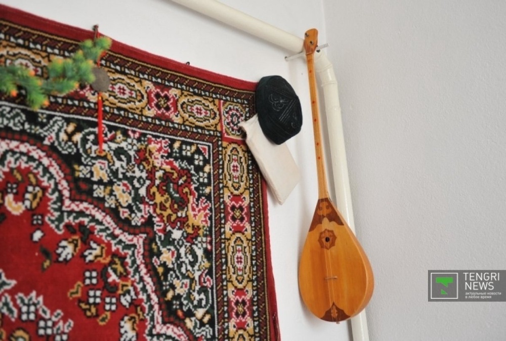 In every Kazakh home there is a place for sacred Koran and a dombyra, Kazakh national musical instrument. ©Nurgisa Yeleubekov