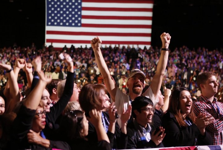 Supporters of U.S. President Barack Obama cheer during his election night rally in Chicago. ©REUTERS/Kevin Lamarque