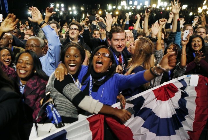 U.S. President Barack Obama supporters cheer during his victory election night rally in Chicago. ©REUTERS/Kevin Lamarque