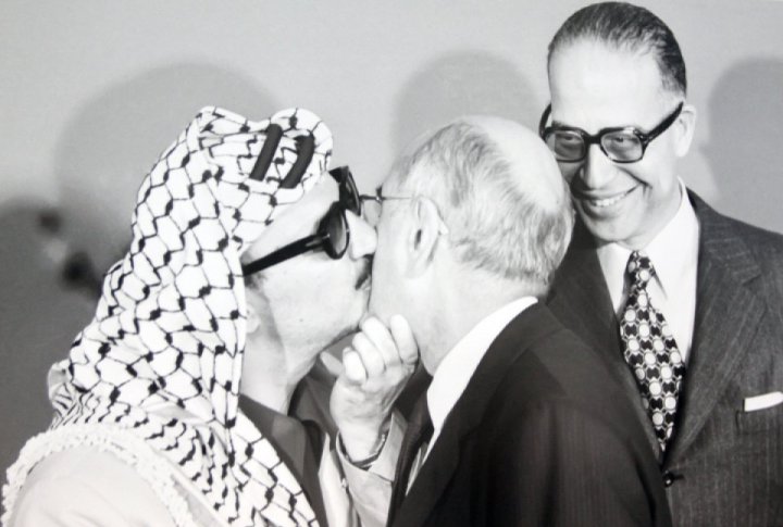 Yasser Arafat, chairman of the executive commission of Palestine Liberation Organization, meeting a visitor at the reception in the UN headquarters where he made his first address to the General Assembly. November 13, 1974. <br>UN Photo/Teddy Chen©