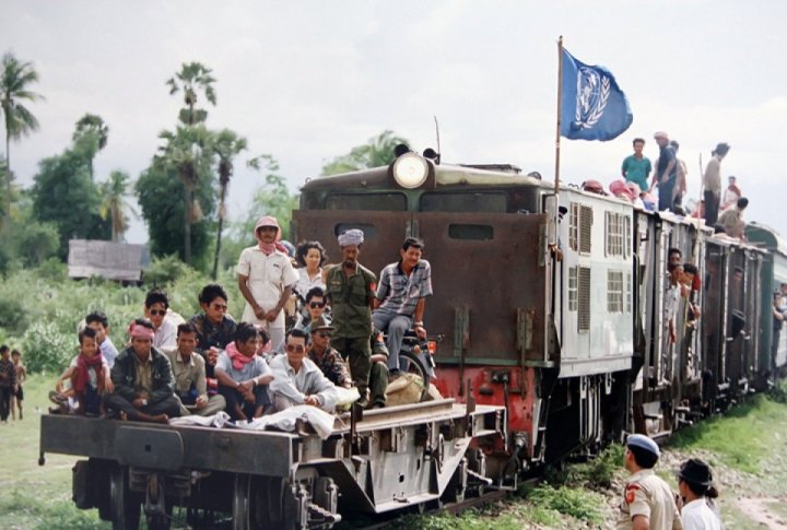 Cambodia refugees returning home from Thailand on a train provided by the UNHCR (UN Refugee Agency). June 1992. <br>UN Photo/Pernaca Sudhakaran©