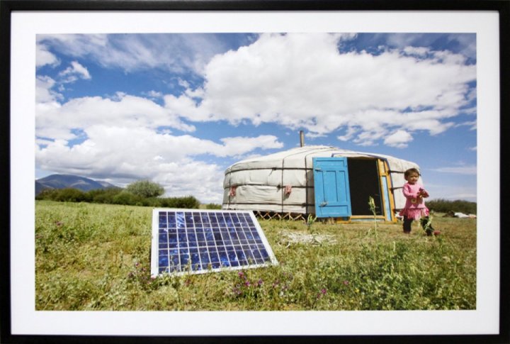 A family using solar panels to generate energy for their yurt, a traditional dwelling in Mongolia. July 28, 2009. <br>UN Photo/Eskinder Debebe©