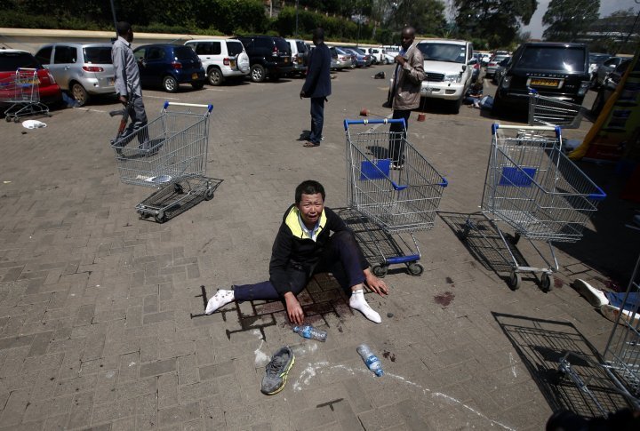 A wounded man screaming in shock at the parking lot of Westgate mall in Nairobi, September 21, 2013. ©REUTERS