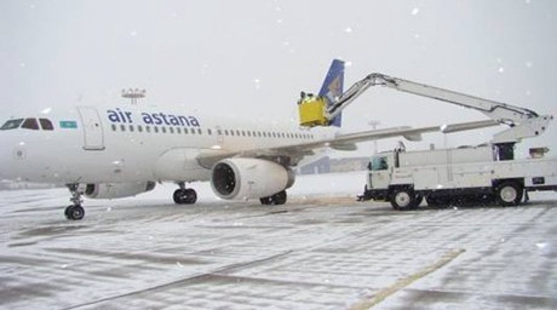 Plane treatment with deicing fluid. Photo courtesy of Air Astana press-service©