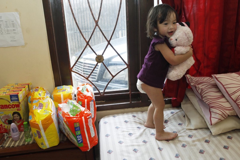 Baby girl plays diaper