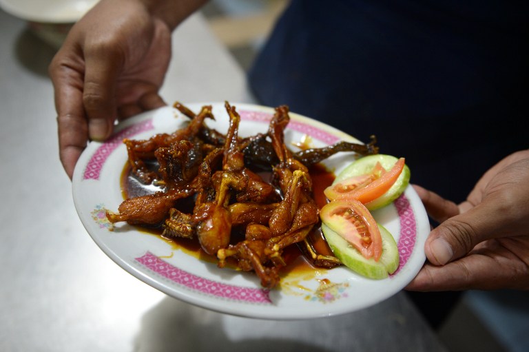 Cooked frog legs. ©AFP
