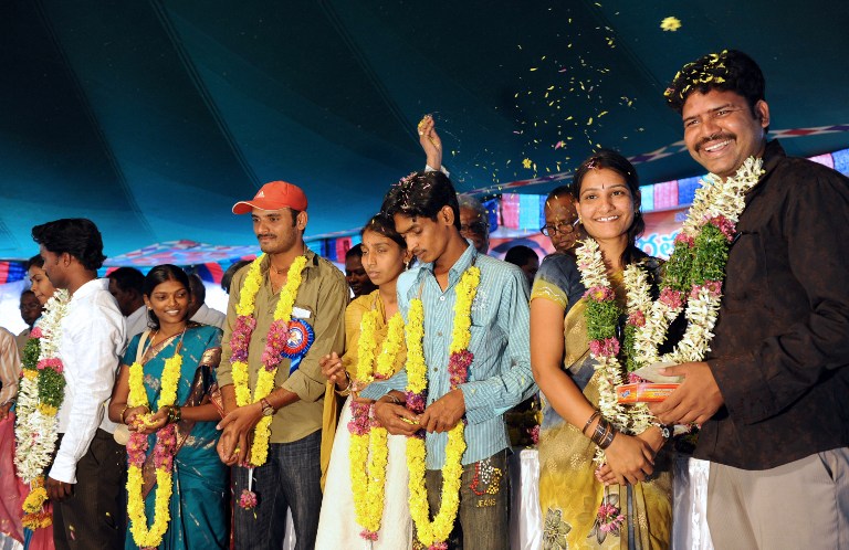 In this file photograph taken on April 14, 2009, Indian couples wed in an inter-caste mass marriage programme organised on Bhimrao Ramji Ambedkar's 119th Jayanthi (birthday or birth anniversary) in Hyderabad.