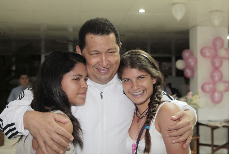 Venezuelan President Hugo Chavez (C) hugging members of his family. ©AFP