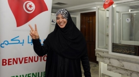 A supporter of Tunisia's Islamist Ennahda party celebrates on October 25, 2011 at the party's headquarters in Tunis. ©AFP 