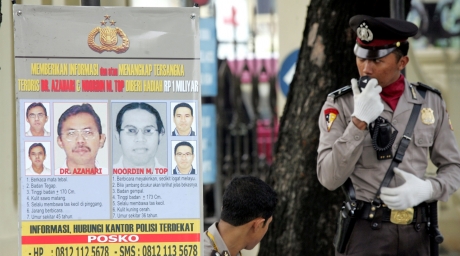 A poster showing wanted suspected Malaysian terrorists Azahari Husin (in poster, L) and Noordin M. Top on a Jakarta street November 10, 2005. ©Reuters 