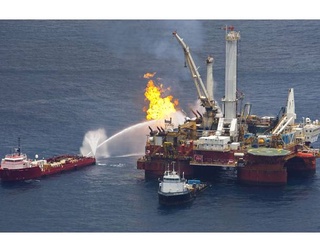 Natural gas being burned off a support vessel above source of Deepwater Horizon oil spill in the Gulf of Mexico 