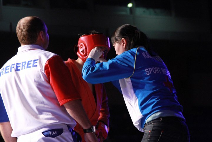 Ospanov receives some medical aid during his final fight. ©Ed G