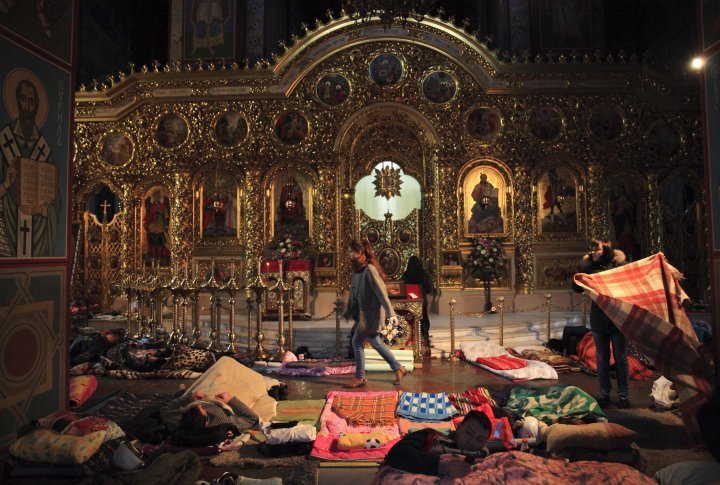 People are resting inside the St. Michael's Golden-Domed Monastery used as a shelter and first-aid post for anti-government protestors. ©Reuters