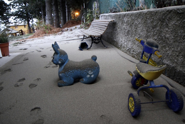 Toys at the playground covered with volcanic ash. ©REUTERS