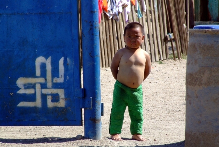 Small but fearless Mongolian boy did not want to let the cameras inside the yard. ©Rustem Rakhimzhan
