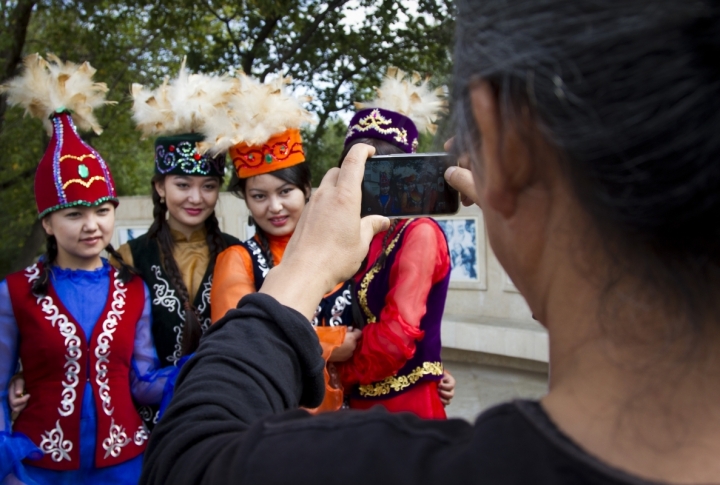 Kim Ki Duk taking pictures of the women in national dresses. <br>Photo by Vladimir Dmitriyev©