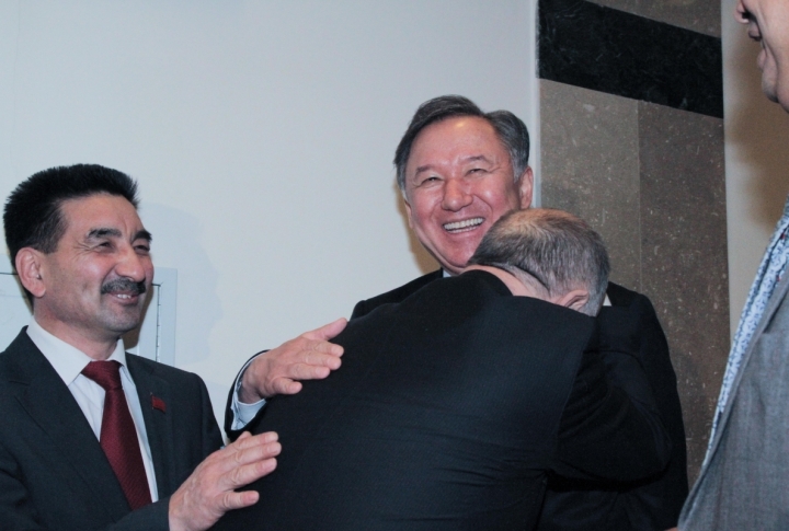 This photograph was made after it was announced that the three communists got into the Parliament. Head of the Communist party Vladislav Kossarev (with his back in the center) is hugging his opponent, deputy chairman of Nur Otan party Nurlan Nigmatulin. Another deputy from the Communist party Zhambyl Akhmetov is on the left. Photo by Danial Okassov©