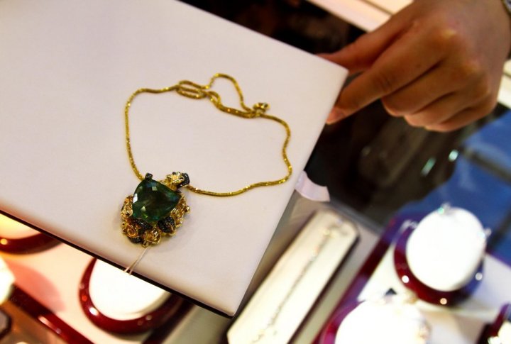 A 14 carat gold necklace with diamonds and 60 carat emerald in the center. Price: 4 million tenge ($27 thousand).