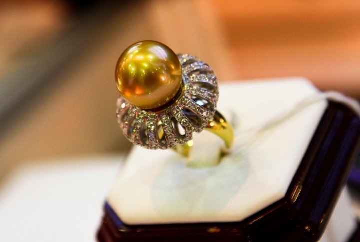 Yellow gold ring with diamonds and 24 carat golden-color pearl in the center. Price: 3 million tenge ($20 thousand). Photo by Danial Okassov©