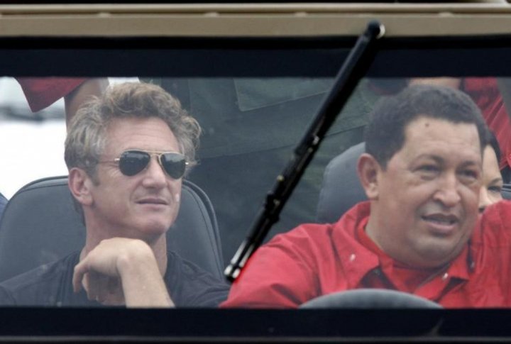 Venezuelan President Hugo Chavez (R) drives his vehicle as U.S actor Sean Penn sits in the back. ©REUTERS/Jorge Silva
