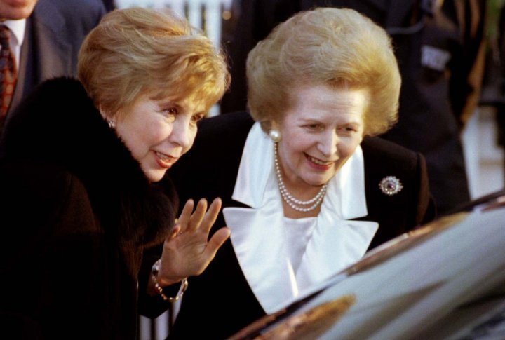 Raisa Gorbachev (L) and Margaret Thatcher wave goodbye , December 7th, 1993. ©REUTERS