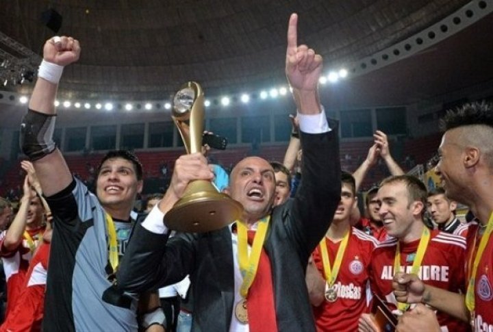 The team's coach Cacau holding the cup. Photo by vesti.kz©