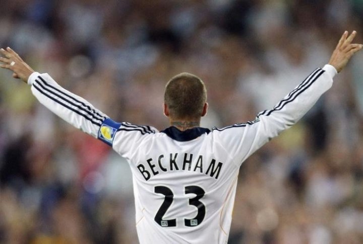 LA Galaxy captain David Beckham celebrates scoring his team's first goal against Sydney FC. ©REUTERS/Tim Wimborne