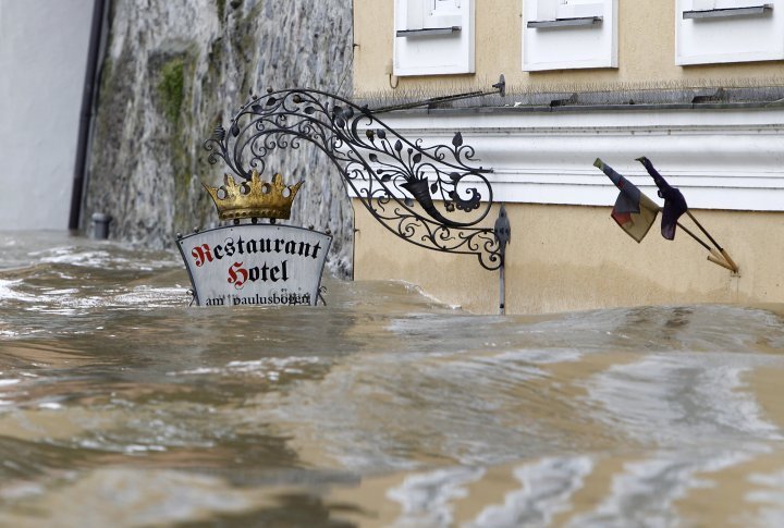 The sign above the door of restaurant and hotel 'Am Paulusbogen' is partially submerged in the flooded centre of the Bavarian town of Passau. ©REUTERS