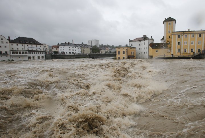 Flooded houses next to river Steyr are pictured during heavy rainfall in the small Austrian city of Steyr. ©REUTERS