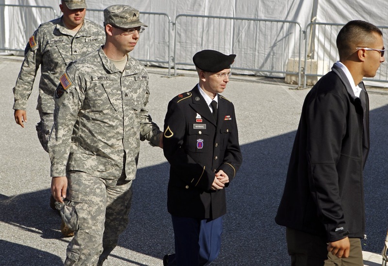 Army Private First Class Bradley Manning is escorted in handcuffs. ©REUTERS/Jose Luis Magaua
