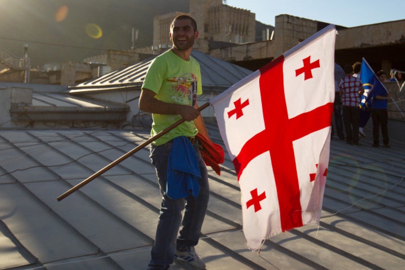 A man holds Georgian flag. ©RIA Novosti