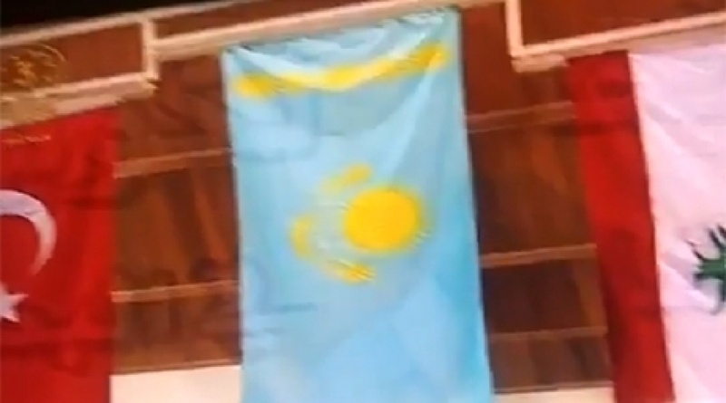 Kazakhstan flag is raised during shooting championship in Kuwait. Snapshot from Youtube video