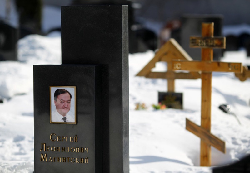 A picture of lawyer Sergei Magnitsky is seen on his grave. ©REUTERS/Mikhail Voskresensky 