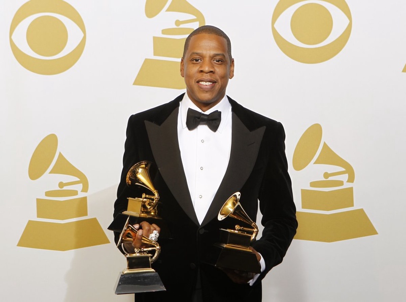 Jay-Z poses with the awards he won for Best Rap Performance, Best Rap/Sung Collaboration and Best Rap Song backstage at the 55th annual Grammy Awards, February 10, 2013. ©Reuters/Mario Anzuoni 