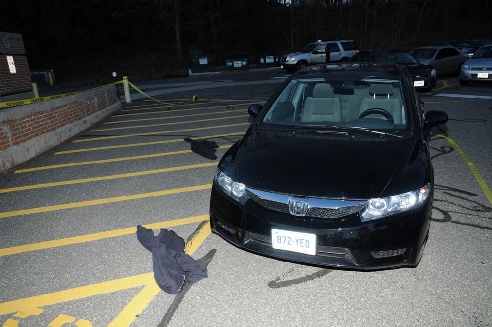 Clothing lays on the ground outside the car Adam Lanza drove to Sandy Hook Elementary School in Newtown, Connecticut. ©Reuters/Connecticut State Police/Handout