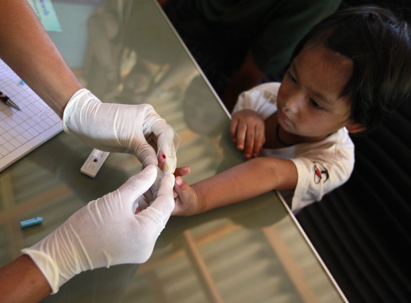 A girl gets tested to ensure a malaria bug she caught a month ago is no longer in her system. ©Reuters
