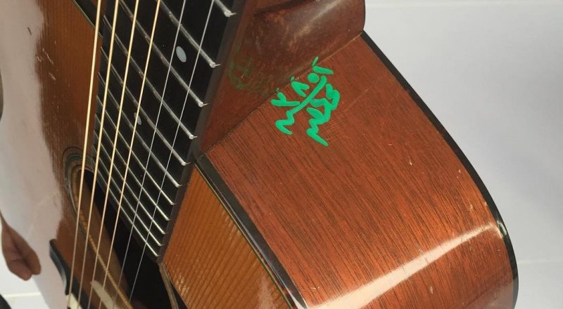 Rock star Bryan Adams shared the photo of his defaced guitar on Instagram. Photo courtesy of Instagram/Bryan Adams